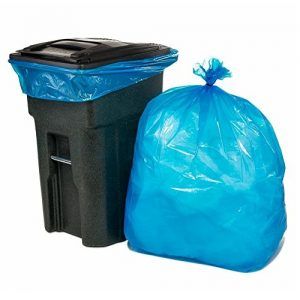 A full garbage bag next to a trashbin
